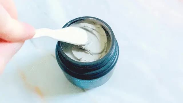 innisfree Super Volcanic Pore Clay Mask 2x opened and sampled on white cosmetic spatula