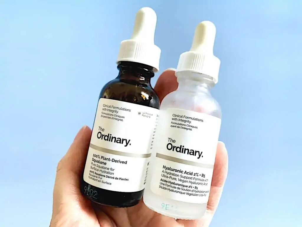 The Ordinary 100% Plant-Derived Squalane and The Ordinary Hyaluronic Acid 2% + B5 in hand