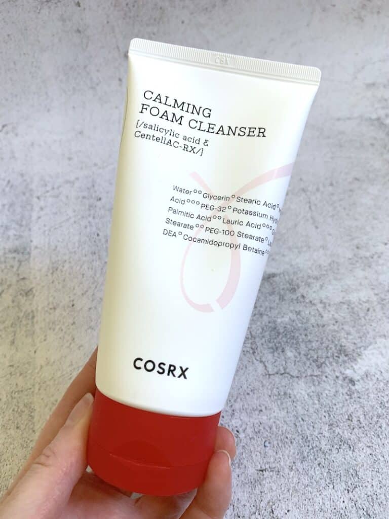 COSRX AC Collection Calming Foam Cleanser handheld.