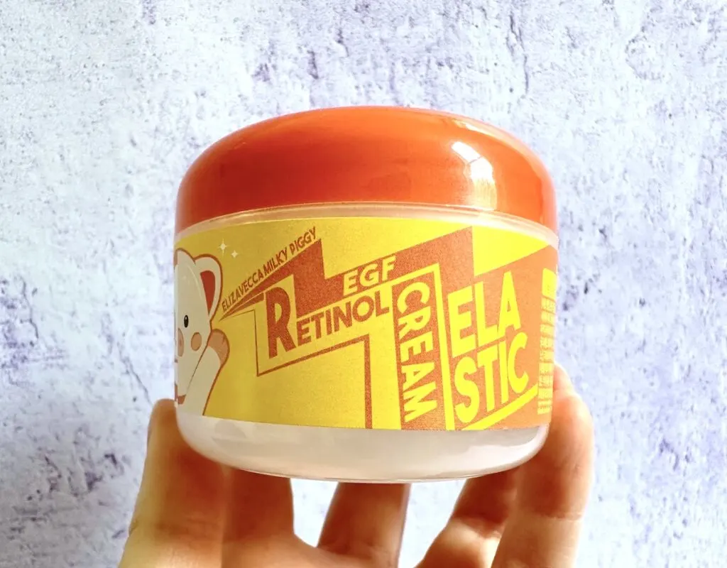 Elizavecca Milky Piggy EGF Elastic Retinol Cream, handheld.
